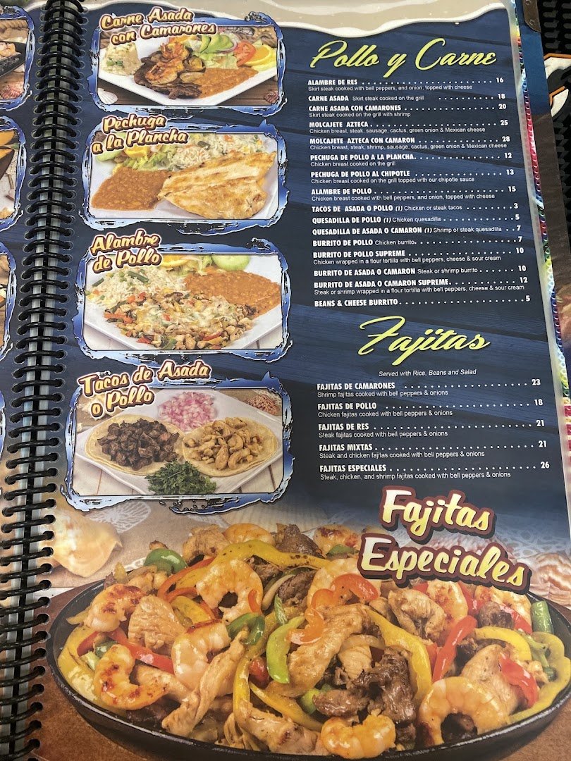Colorful dishes beside drinks and table service.